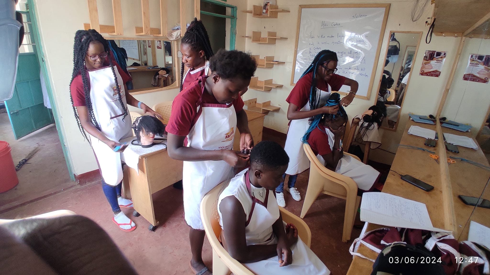 AMUAA students sharing their work at a community event
